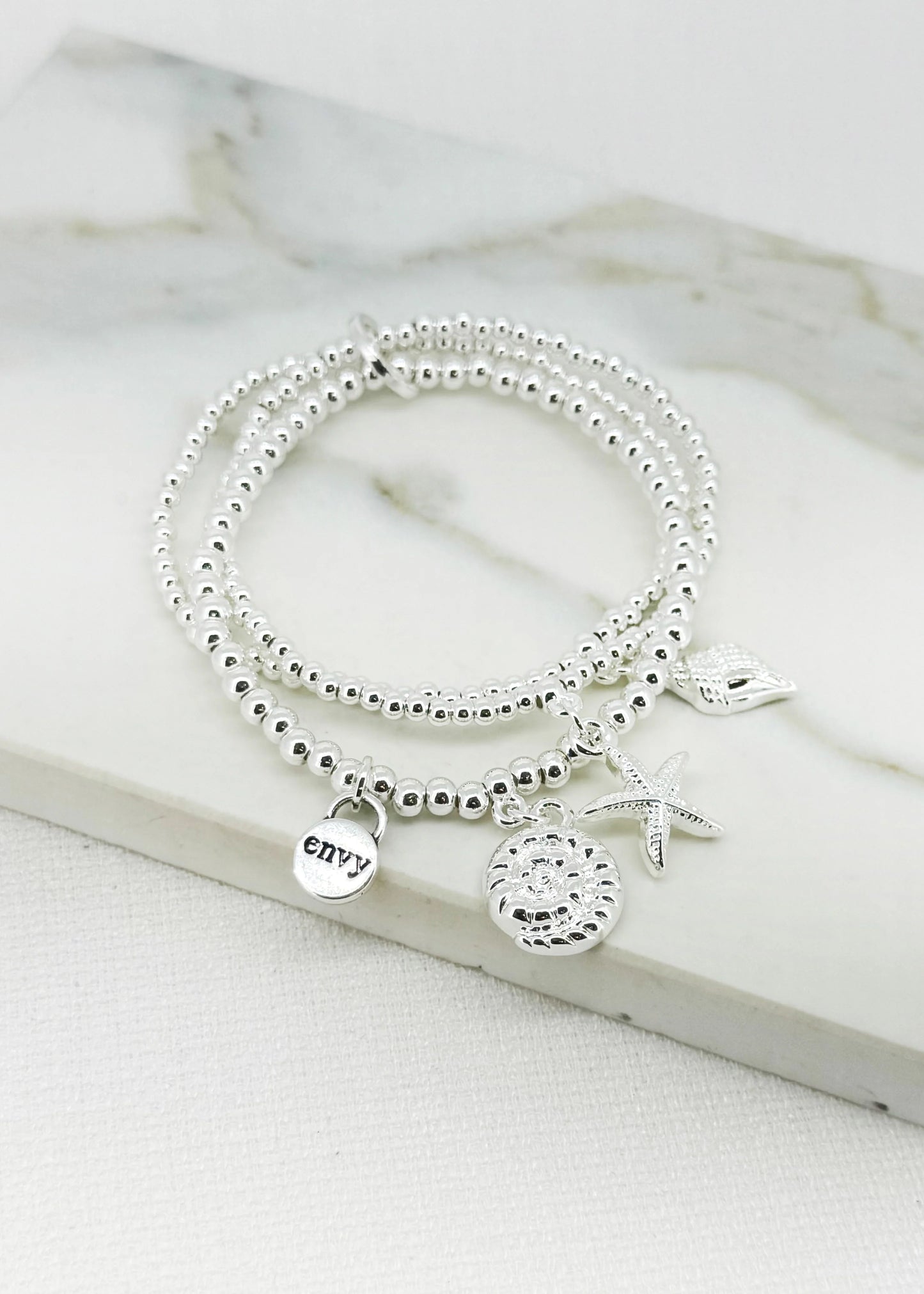 Silver triple layered stretch bracelet with sea charms