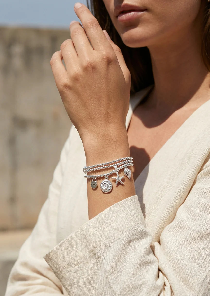 Silver triple layered stretch bracelet with sea charms