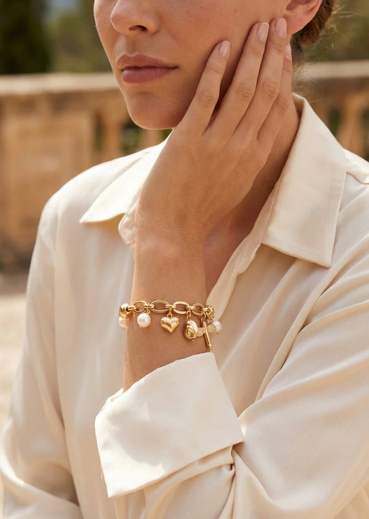 Elasticated gold and pearl ball charm bracelet