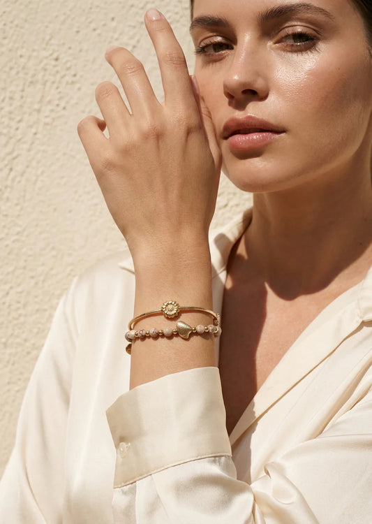 Elasticated taupe and gold two layer bracelet with starfish design